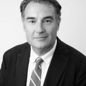 Black and white image of Sight For All Co-Founder, James Muecke